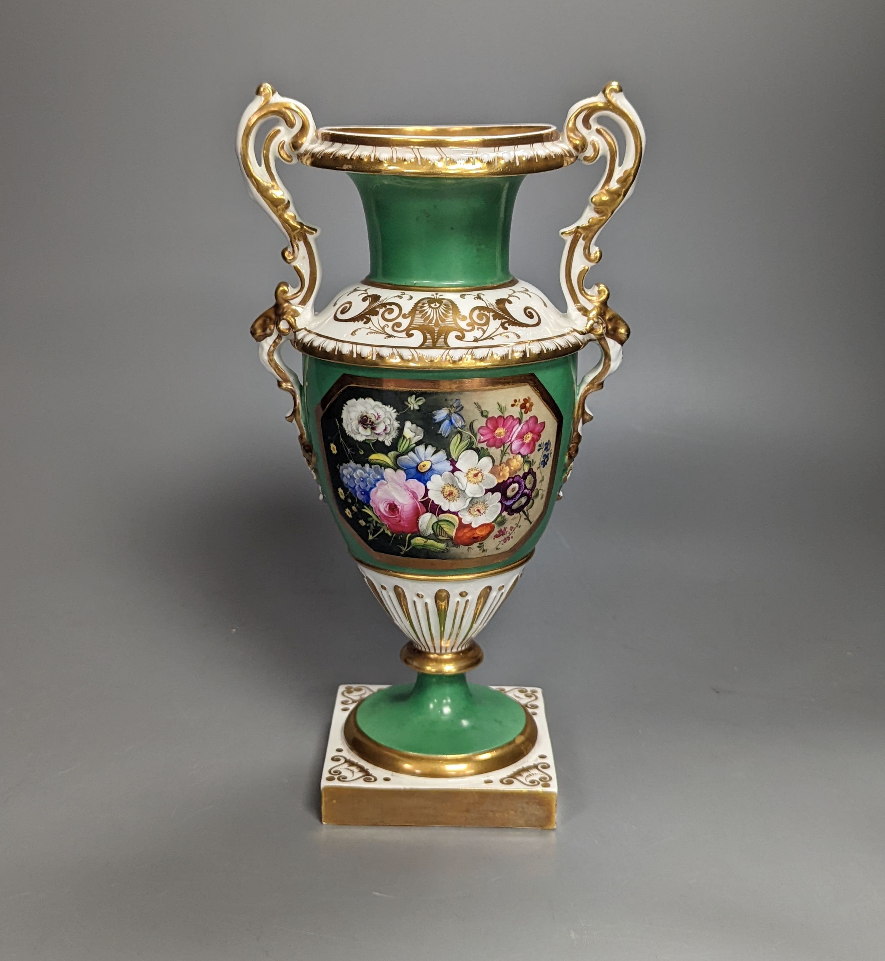 An English porcelain two handled vase painted with flowers in a panel on a green ground, probably Grainger Worcester, c.1830, height 24cm